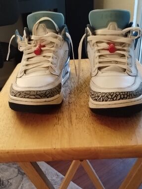 Jordan Men's Size 11 White and Black Athletic Shoes with Light Blue Accent
